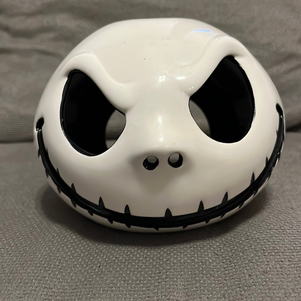 Never used. Jack the pumpkin king tea light candle holder.